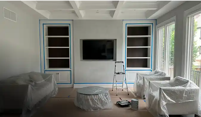 Bright, freshly painted living room with white walls and modern décor.